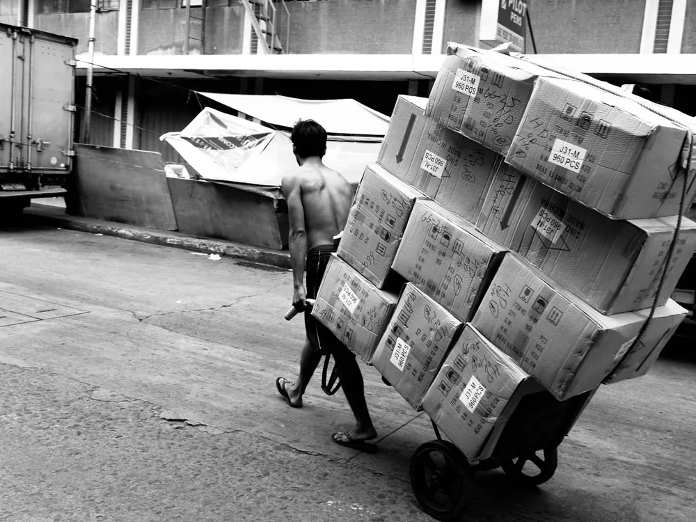 A hand truck loaded with boxes