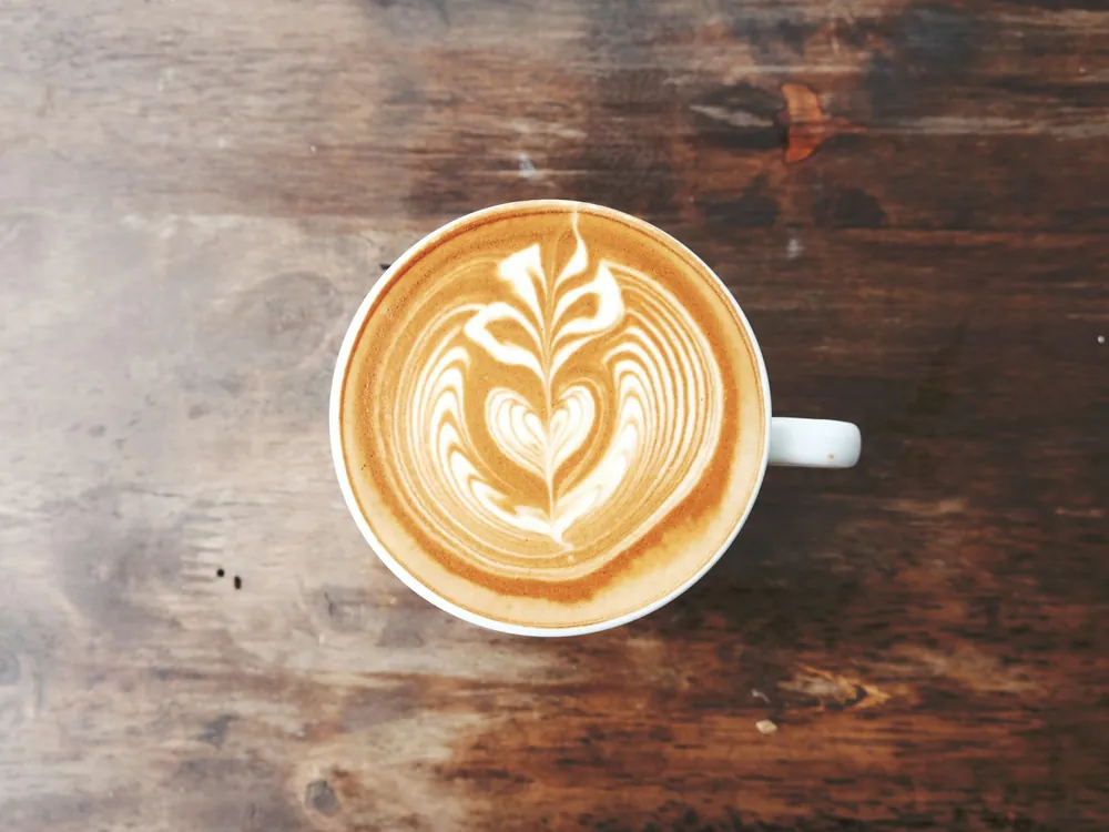 A latte with a heart in the foam