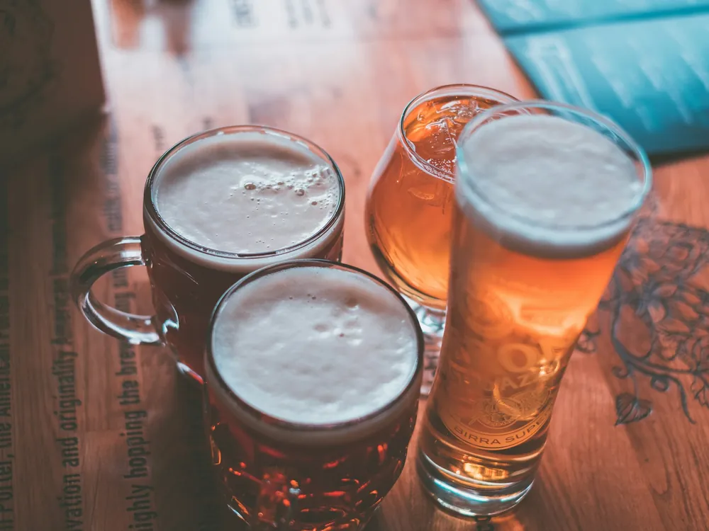 Glasses of beer on a table