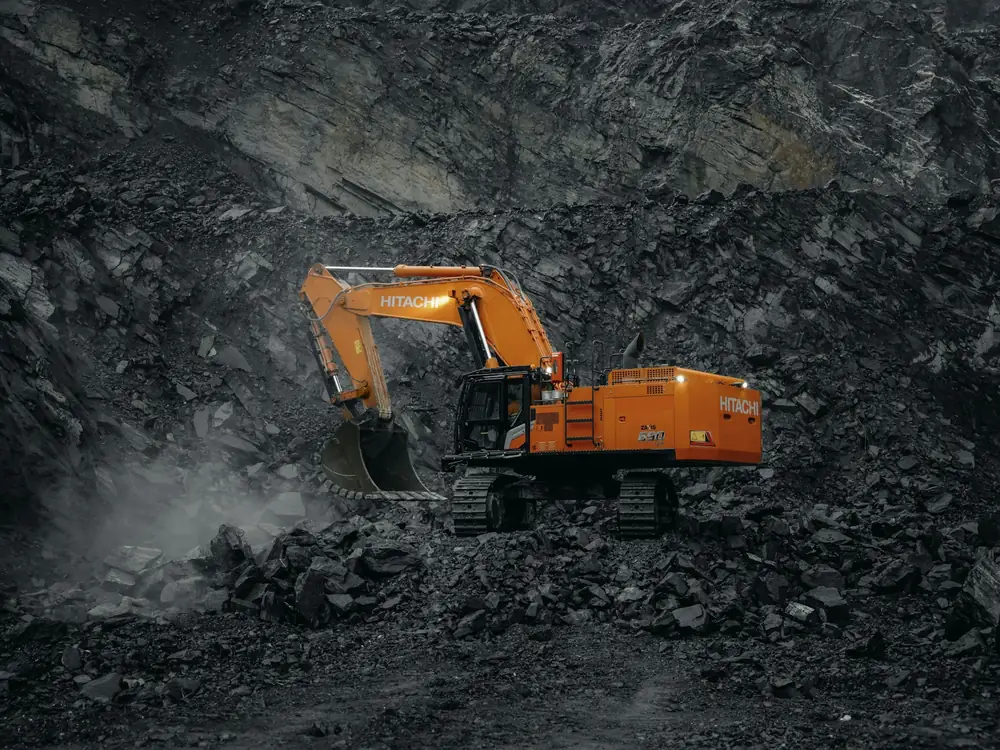 An orange excavator at work