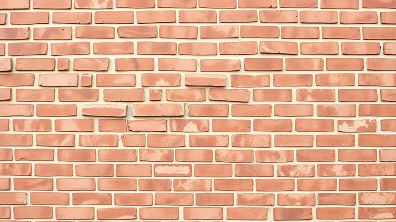 A freshly laid red brick wall with neat mortar joints